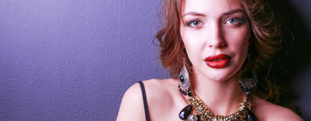 Portrait of young beautiful woman with jewelryの写真素材