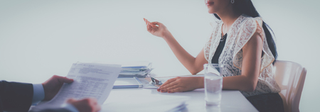 Woman with documents sitting on the deskの写真素材
