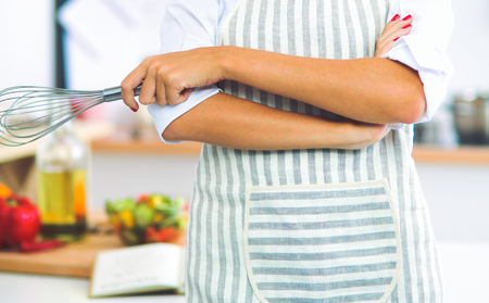 Smiling young woman in the kitchenの写真素材