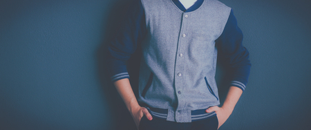 Portrait of a handsome young man on black backgroundの写真素材