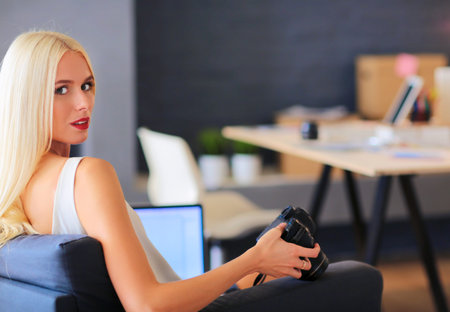 Young photographer and graphic designer at workの写真素材