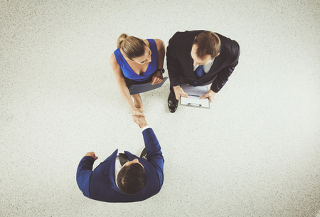 Business people shaking hands - topview .の写真素材