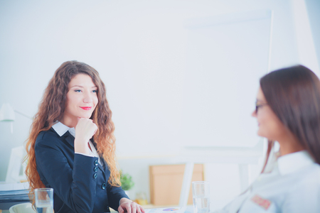 Business people sitting and discussing at business meeting, in office. Business peopleの写真素材