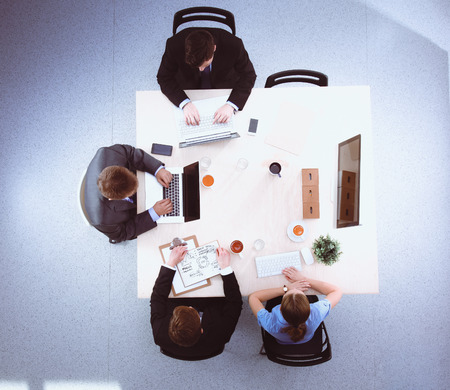 Business people sitting and discussing at business meeting.の写真素材