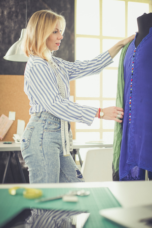 Young fashion designer working at studio.の写真素材