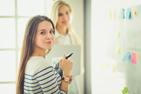 Beautiful smiling pregnant woman with the doctor at hospitalの写真素材