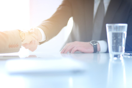 Portrait of businessman giving hand for handshakeの写真素材