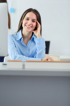 Attractive business woman working on laptop at office. Business peopleの写真素材