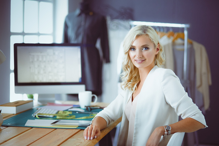 Fashion designer woman working on her designs in the studioの写真素材