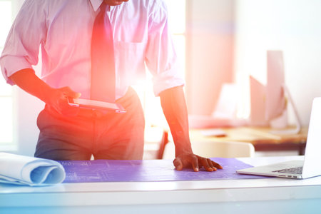 Portrait of an handsome black businessman standing in officeの写真素材