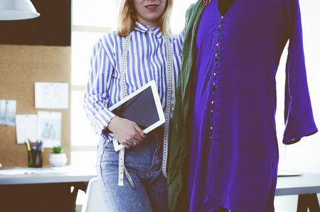 Fashion designer working on her designs in the studioの写真素材