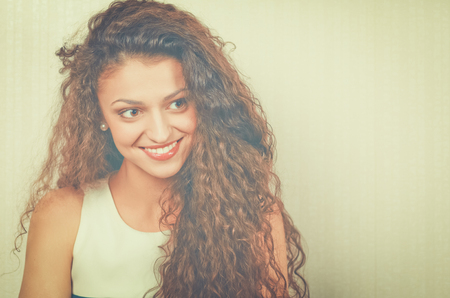 Beautiful female in sundress posing on white backgroundの写真素材