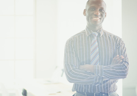Portrait of an handsome black businessman standing in officeの写真素材