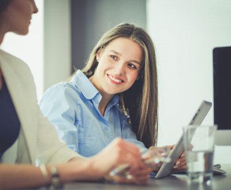 Attractive business woman working on laptop at office. Business peopleの写真素材