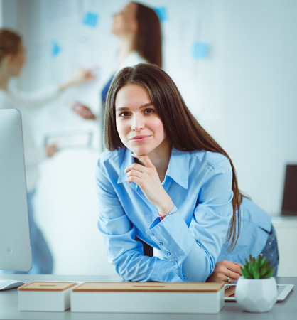 Attractive business woman working on laptop at office. Business peopleの写真素材
