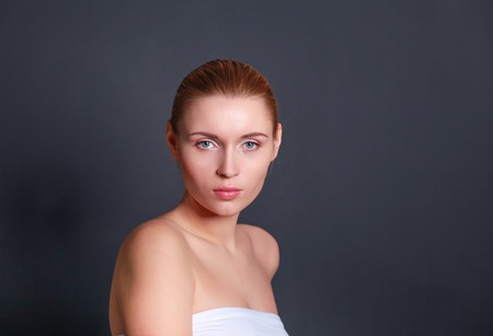 Portrait of beautiful woman isolated on gray backgroundの写真素材