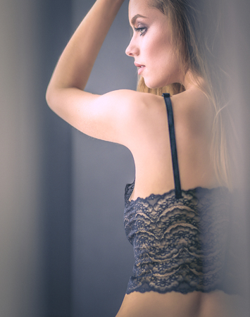 Sexy fashionable woman on the bedの写真素材