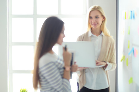 Beautiful smiling pregnant woman with the doctor at hospitalの写真素材