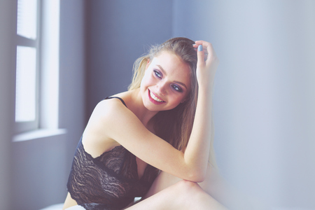 Sexy fashionable woman on the bedの写真素材