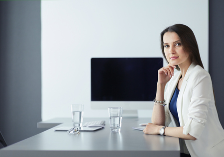 Attractive business woman working on laptop at office. Business peopleの写真素材