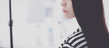 Beautiful young woman in shopの写真素材