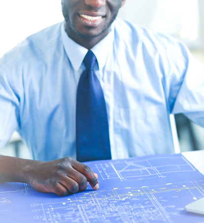 Portrait of an handsome black businessman standing in officeの写真素材