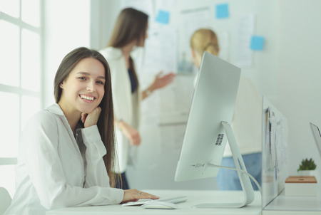 Attractive business woman working on laptop at office. Business peopleの写真素材