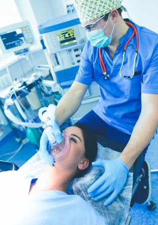 Man surgeon at work in operating roomの写真素材