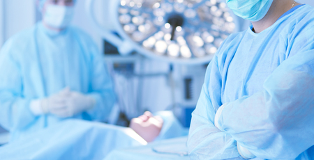 Male surgeon on background in operation roomの写真素材