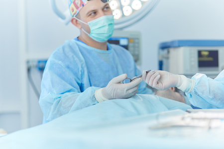 Team surgeon at work in operating roomの写真素材