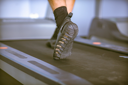 Group of people at the gym exercising on cross trainers. people at the gymの写真素材