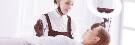 Microblading eyebrows work flow in a beauty salon.の写真素材