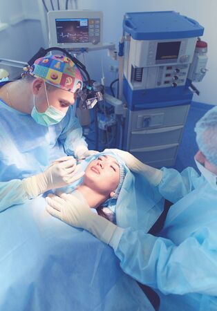 Man surgeon at work in operating roomの写真素材