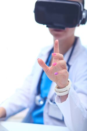 Doctor woman looking through phoropter during eye exam. Doctor womanの写真素材