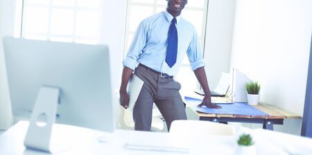 Portrait of an handsome black businessman standing in officeの写真素材