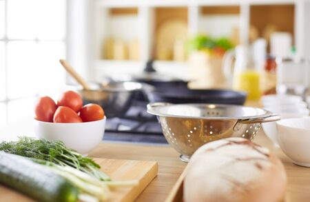 Man preparing delicious and healthy food in the home kitchen.の写真素材