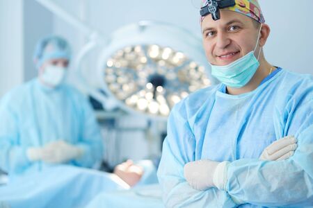 Male surgeon on background in operation roomの写真素材