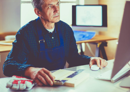 Architect working on drawing table in office