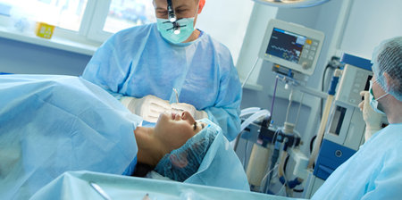 Man surgeon at work in operating room