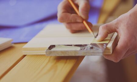 Architect working on drawing table in office.の写真素材