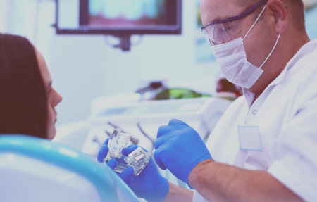 Dentist and his assistant carrying out a thorough examination.
