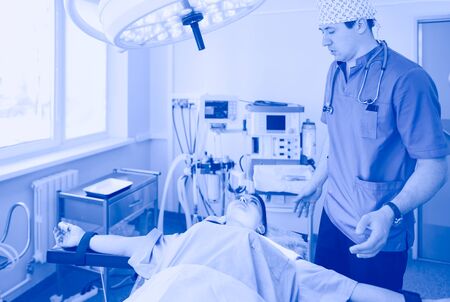 Male surgeon on background in operation roomの写真素材