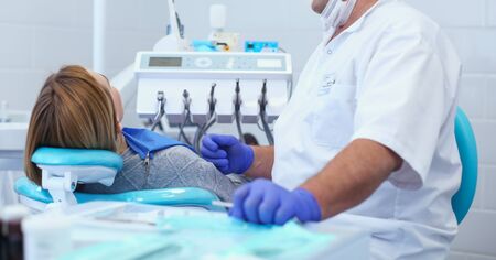 Doctor and patient in the dental clinicの写真素材