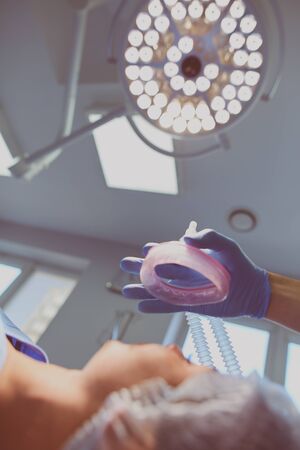 Man surgeon at work in operating roomの写真素材