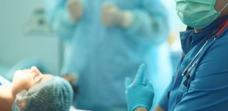 Male surgeon on background in operation room.
