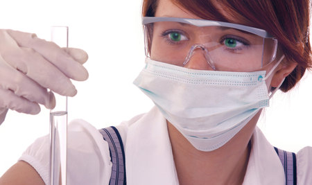 Portrait of female doctor standing against isolated on white background. Woman doctor in a mask.