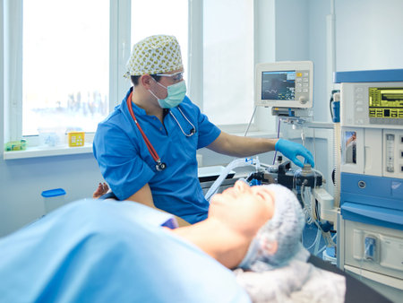 Man surgeon at work in operating room.