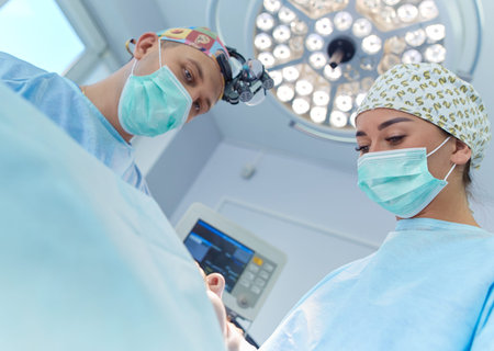 Male surgeon on background in operation room.