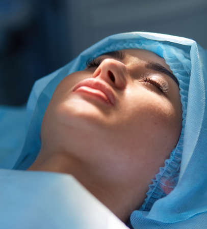 Man surgeon at work in operating room.の写真素材