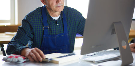 Architect working on drawing table in office